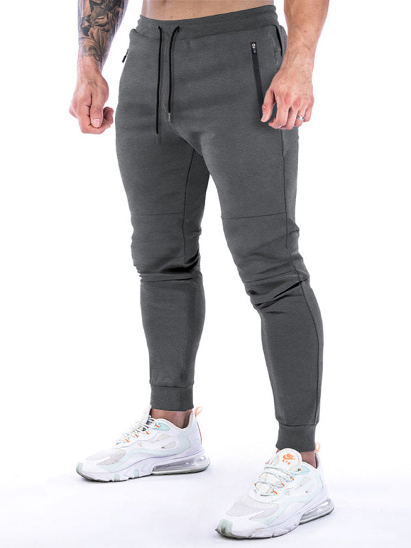 Pantaloni da allenamento per piedi con asciugamano appesi sul retro per sport fitness da uomo 